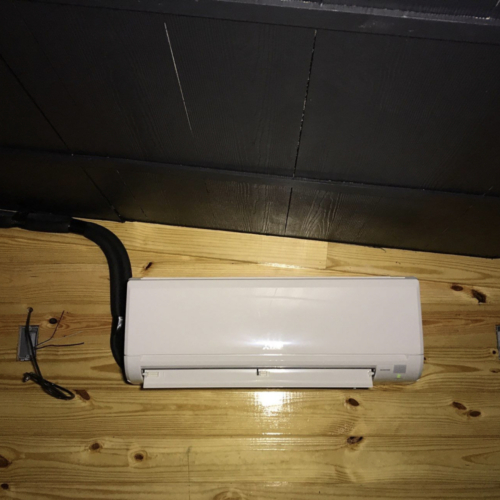 mini split on a wood wall