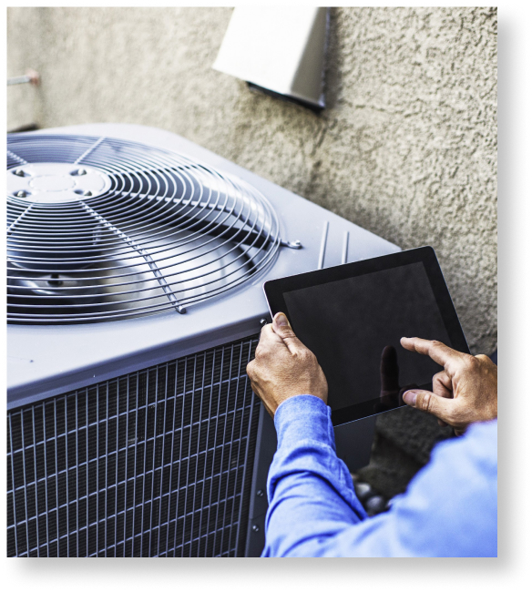 person using an ipad by a hvac unit